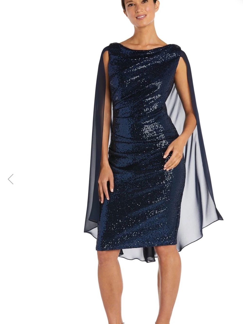 Black sequin cocktail dress by R&M Richards dramatic, sheer shawl pleated waist